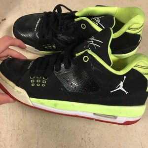 Green, red, white and black jordan flights.